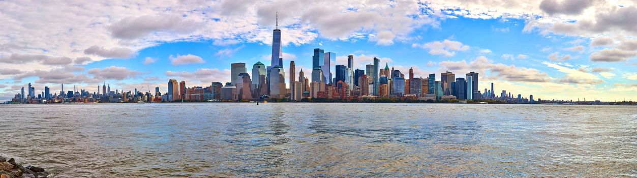 Image of Full stunning New York City skyline on sunny morning from New Jersey with choppy waters