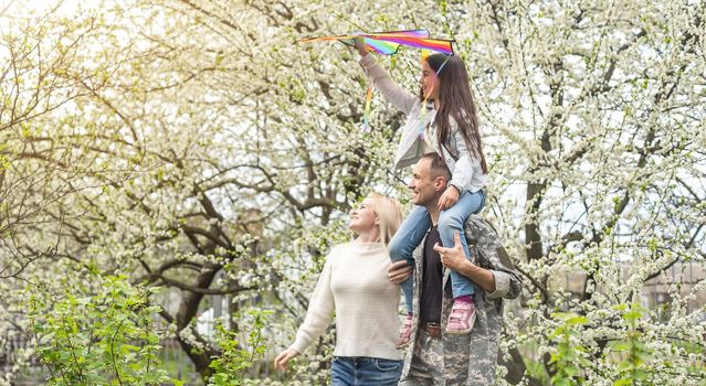 Soldier reunited with his family in park