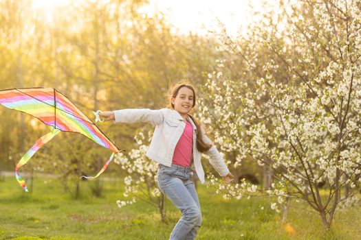 little girl with a kite in the spring. Childhood, Children's Day.
