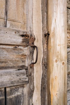 wooden barn door with handle. old wooden buildin