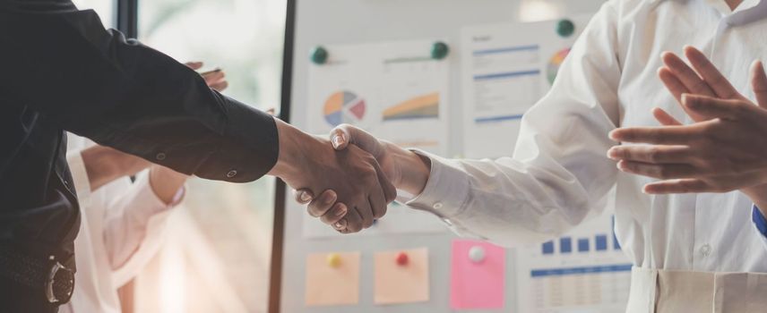 Business handshake and business people.Business people shaking hands,finishing up a meeting..