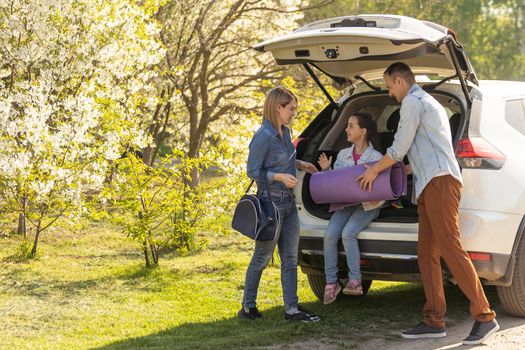 asian muslim family with suitcase prepare to go. concept of family travelling.