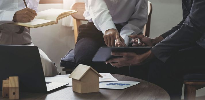 Close up Business woman or Real Estate agent explain signing agreement for buying house. Bank manager and real estate concept.