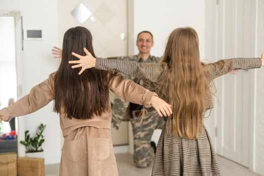 Soldier On Leave Hugging Daughter.