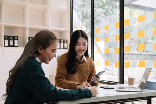 Asian business meeting to analyze and discuss the situation on the financial report in the meeting room.Investment Consultant, Financial advisor and accounting concept.
