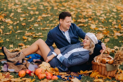 Happy couple enjoying golden autumn spring season in the park.