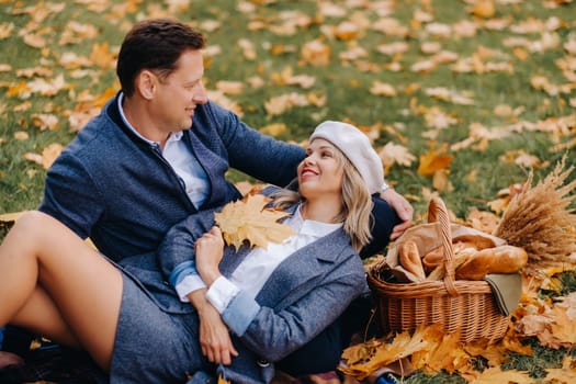 Happy couple enjoying golden autumn spring season in the park.