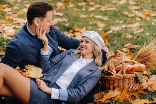 Happy couple enjoying golden autumn spring season in the park.