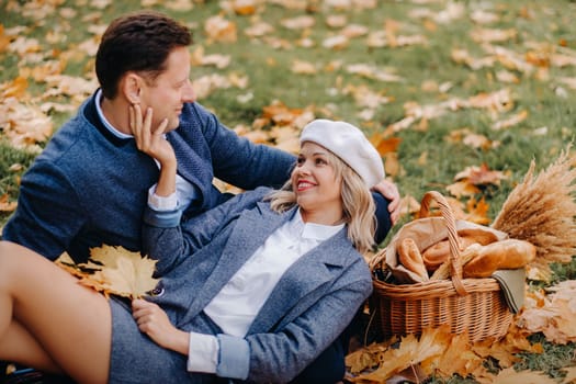 Happy couple enjoying golden autumn spring season in the park.