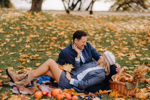 Happy couple enjoying golden autumn spring season in the park.