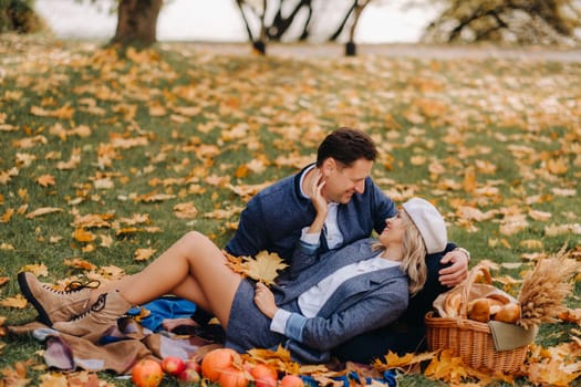 Happy couple enjoying golden autumn spring season in the park.