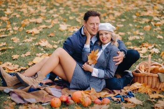 Happy couple enjoying golden autumn spring season in the park.