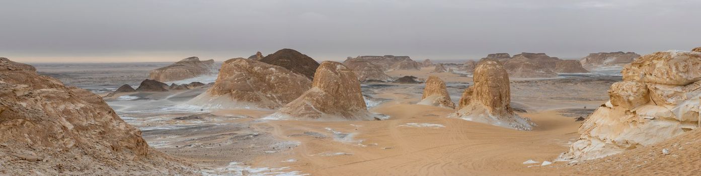 Landscape scenic view of desolate barren western desert in Egypt Valley of Agabat Obstacles at Farafra Oasis with geological rock formations
