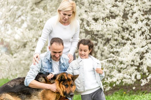 Happy family having picnic in nature. Smiling family picnicking in the park. spring nature.