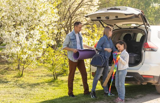 asian muslim family with suitcase prepare to go. concept of family travelling.