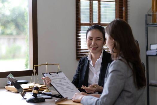 business people and lawyers discussing contract papers sitting at the table. Concepts of law, advice, legal services, legal and judgment concept.