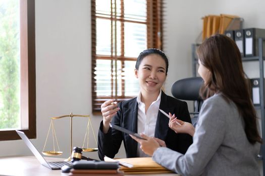 business people and lawyers discussing contract papers sitting at the table. Concepts of law, advice, legal services, legal and judgment concept.