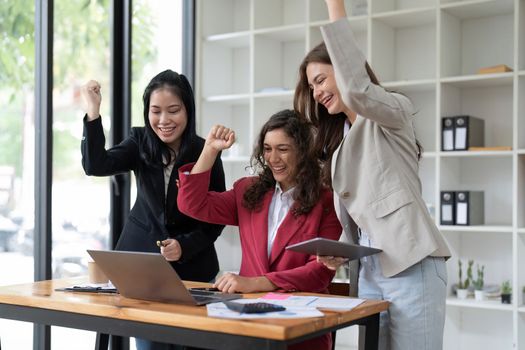 Successful business advisor people achieving goals while using laptop computer.