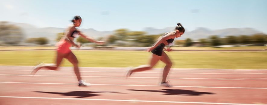 Sports, fitness and relay race with a woman athlete passing a baton to a teammate during a track race. Running, teamwork and health with a female runner and partner racing for competitive sport.