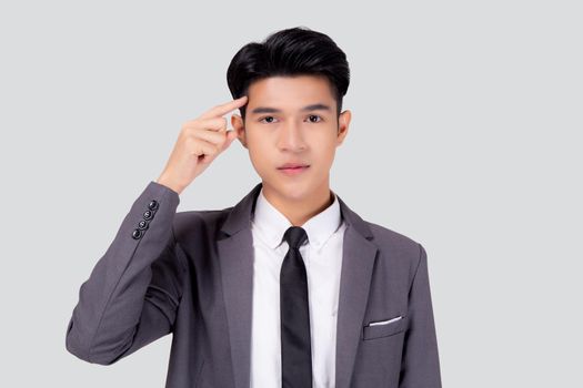 Portrait young asian business man in suit with smart thinking idea with intelligent isolated on white background, businessman standing and planning for success, manager or executive pointing head.