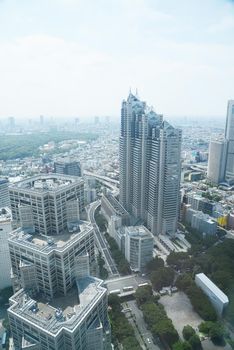 an aerial view of buildings in tokyo as seen from a building observatory