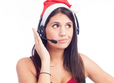 Christmas headset woman from telemarketing call center wearing red santa hat talking smiling isolated on white background.