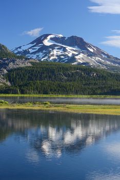 Mount Sister with reflection over a lake in Oregon