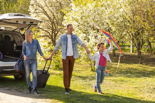 happy family enjoying road trip and summer vacation