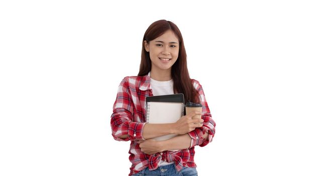 Portrait of young asian university student or college student in red Scott shirt holding a coffee cup, tablet and notebook standing over white background