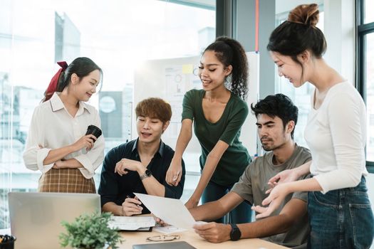 Young asian people having business meeting in office. teamwork brainstorming planning meeting concept.