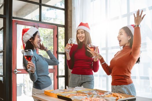 Christmas party cheerful young friends with champagne.