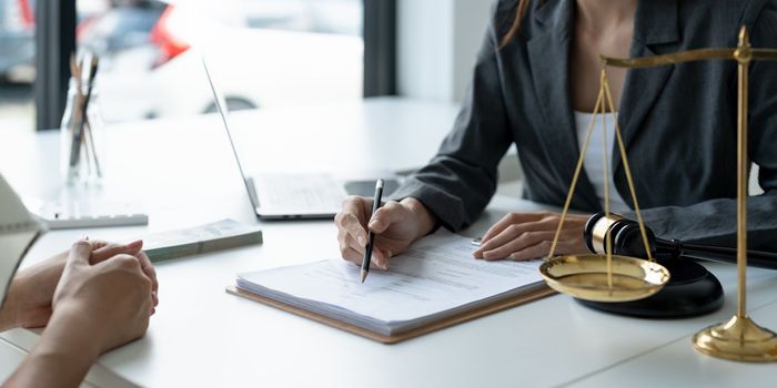 Businesswoman and lawyer discuss the contract document. Treaty of the law. Sign a contract business