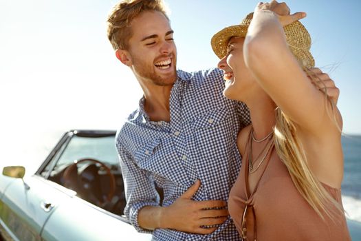 Car park, happy road trip, and travel couple on holiday bonding adventure, transportation journey or fun summer vacation. Ocean sea, convertible driver or driving people relax in Portugal countryside.