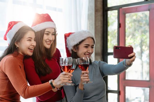 Christmas party cheerful young friends with champagne.