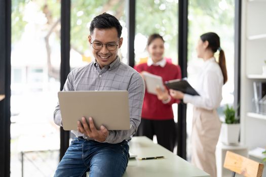 Portrait asian businessman using laptop computer in meeting room