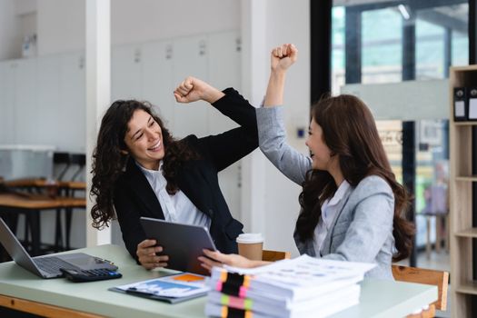 Group of diverse young business team creative businesspeople coworker in office Happy to be successful partnership teamwork celebrating achievement and success concept