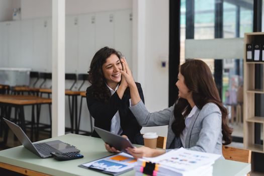 Group of diverse young business team creative businesspeople coworker in office Happy to be successful partnership teamwork celebrating achievement and success concept