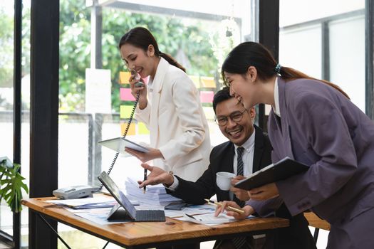 Group of business asian people busy working at office. business discussion concept.