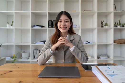 Portrait smile beautiful business asian woman in suit working in office