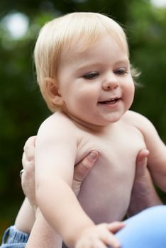 He loves his mommy so much. a baby boy playing with his mother