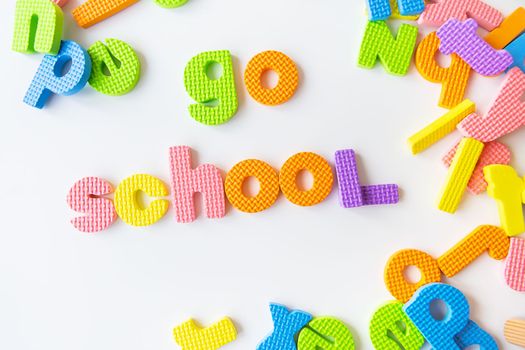 Multicolored letters. Letters for the study of children in kindergarten or school, fluted letters. Go school inscription
