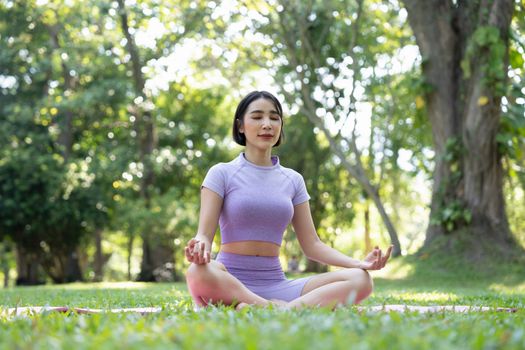 Close up hands. Woman do yoga relax outdoor. Woman exercising pose vital and meditation for fitness lifestyle club at the outdoors nature background. Healthy and Yoga Concept