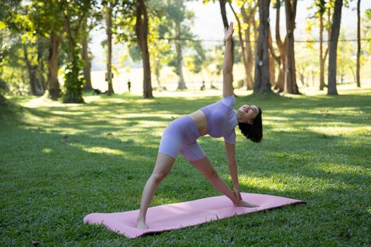 Portrait of happiness young woman practicing yoga on outdoors.Yoga and relax concept. Beautiful girl practice asana.