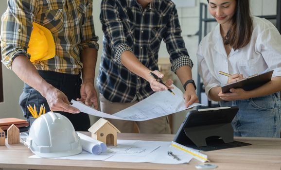 Group of engineer and architect working in office with blueprints, inspection in workplace for architectural plan, construction project, Business construction