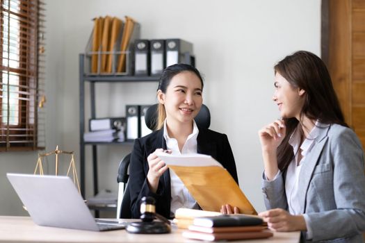 business people and lawyers discussing contract papers sitting at the table. Concepts of law, advice, legal services, legal and judgment concept..