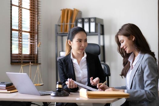 business people and lawyers discussing contract papers sitting at the table. Concepts of law, advice, legal services, legal and judgment concept..