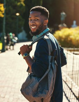 Black man, student on campus for university in outdoor portrait, education and study with backpack. College, smile and higher education with learning for development and scholarship, going to class