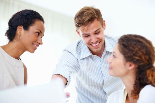 Smiling business people working on laptop. Business people working on laptop and smiling