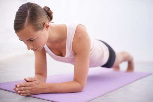 Yoga helps her find comfort in solitude. An attractive young woman in a yoga position