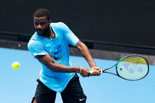 MELBOURNE, AUSTRALIA - JANUARY 13: Frances Tiafoe (USA) practices ahead of the 2023 Australian Open at Melbourne Park on January 13, 2023 in Melbourne, Australia.